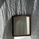 Small antique English rectangular mirror with pediment and oak frame