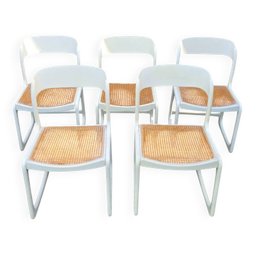 Set of 5 white Baumann "Traineau" chairs.