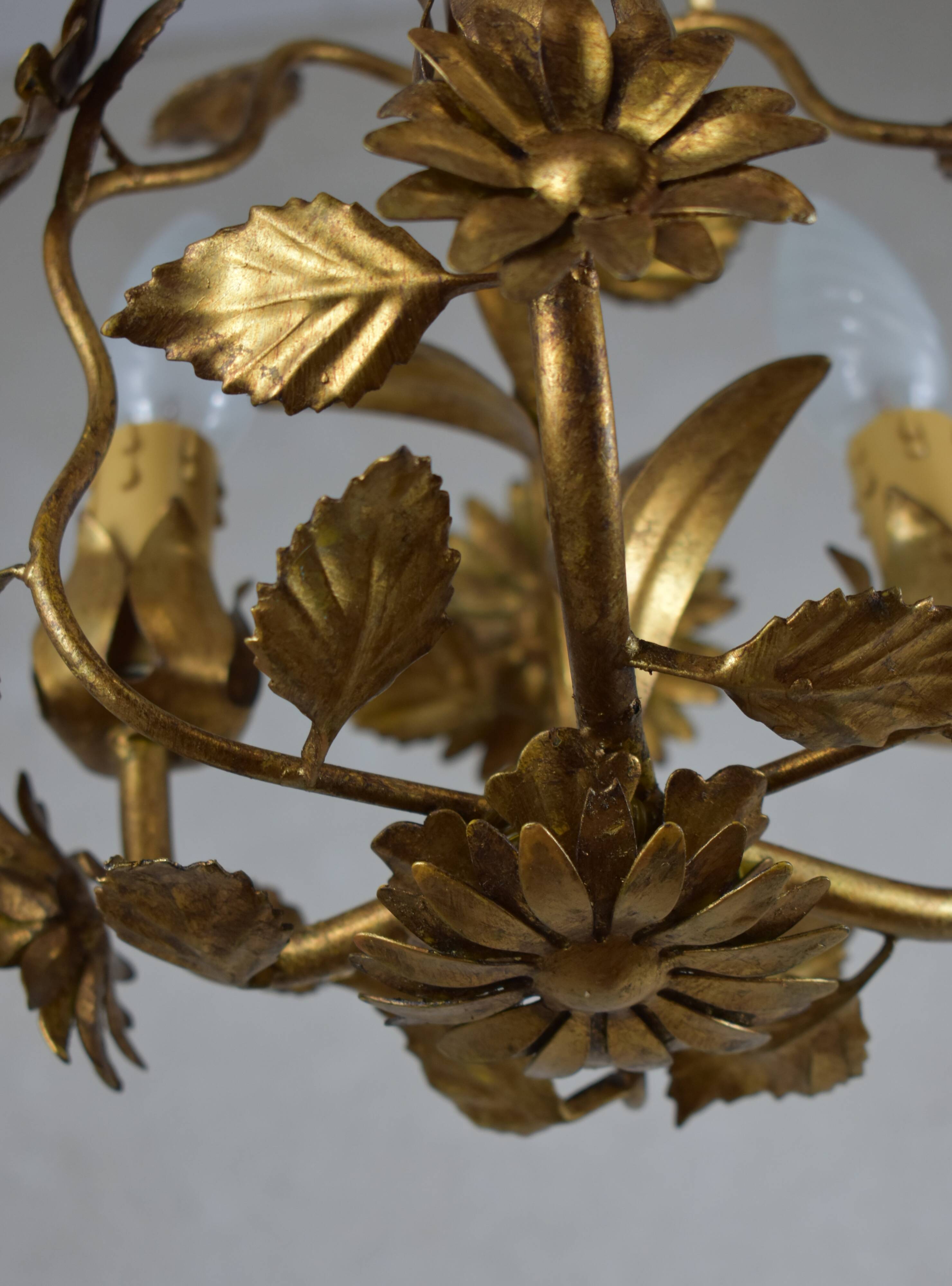 golden chandeliers with flowers.