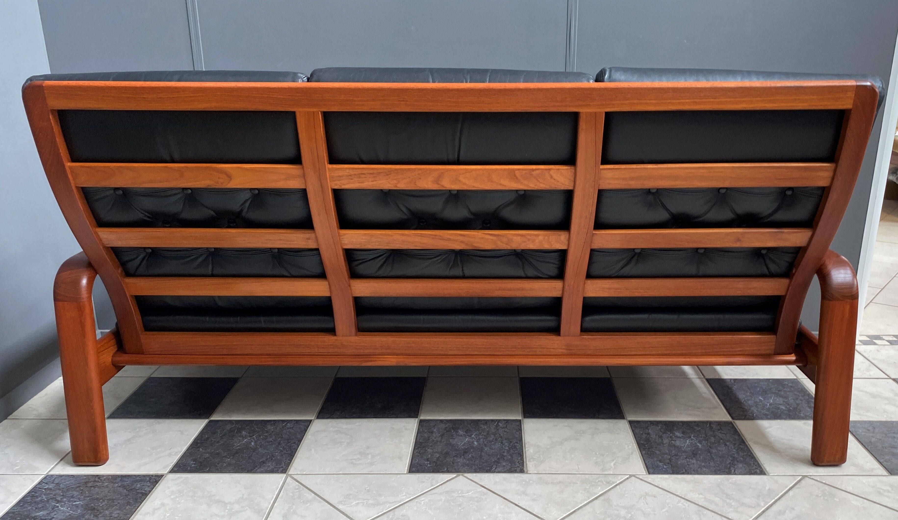 Teak and Black Leather 32 seat sofa by HS Denmark 1970s