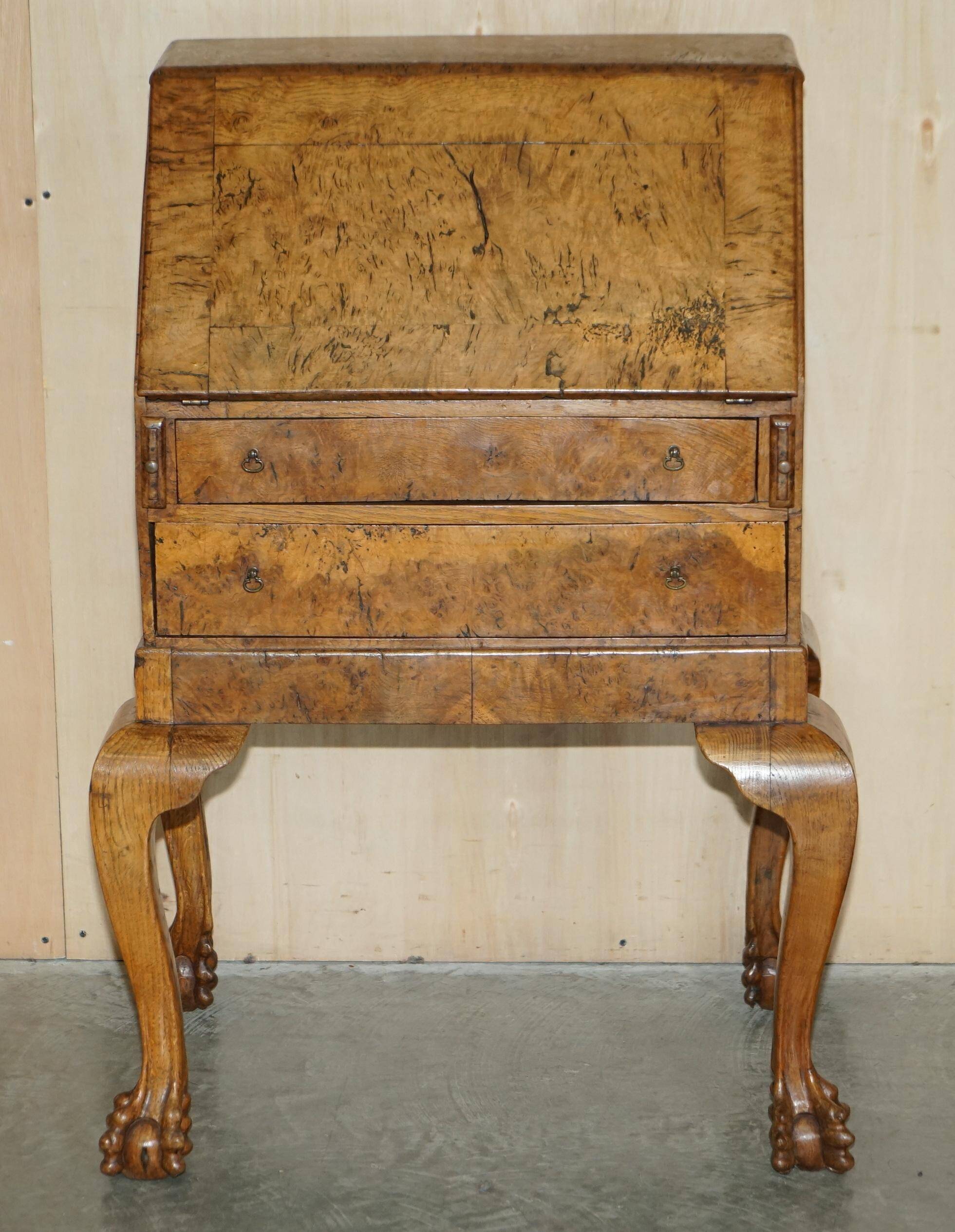 Writing desk in pollard oak from around 1800 with claw and ball carved legs.