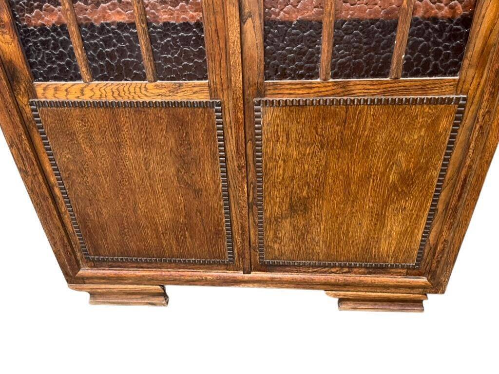 Vintage wooden display cabinet with textured glass.