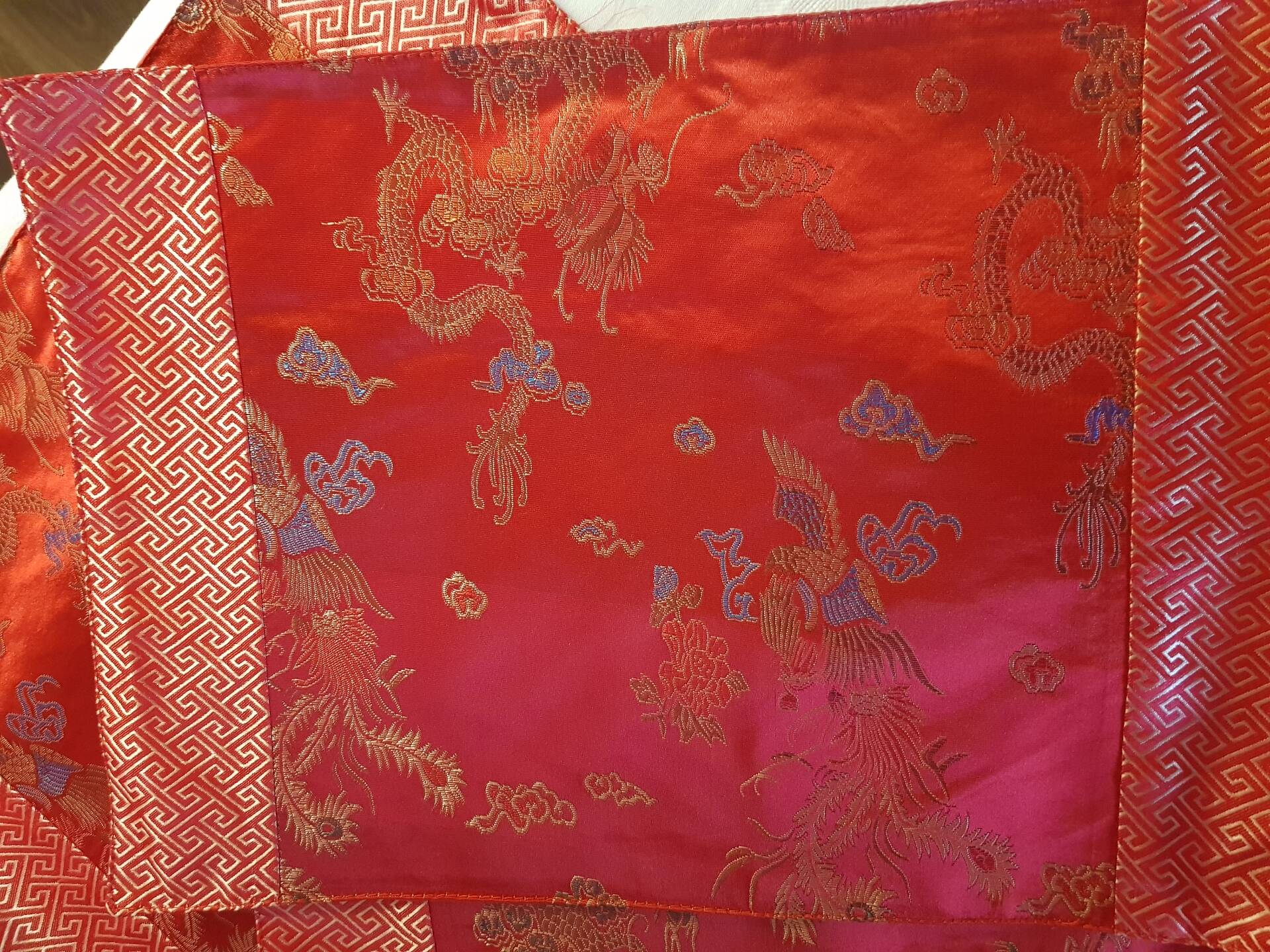 Set of 6 small table napkins in red brocade.