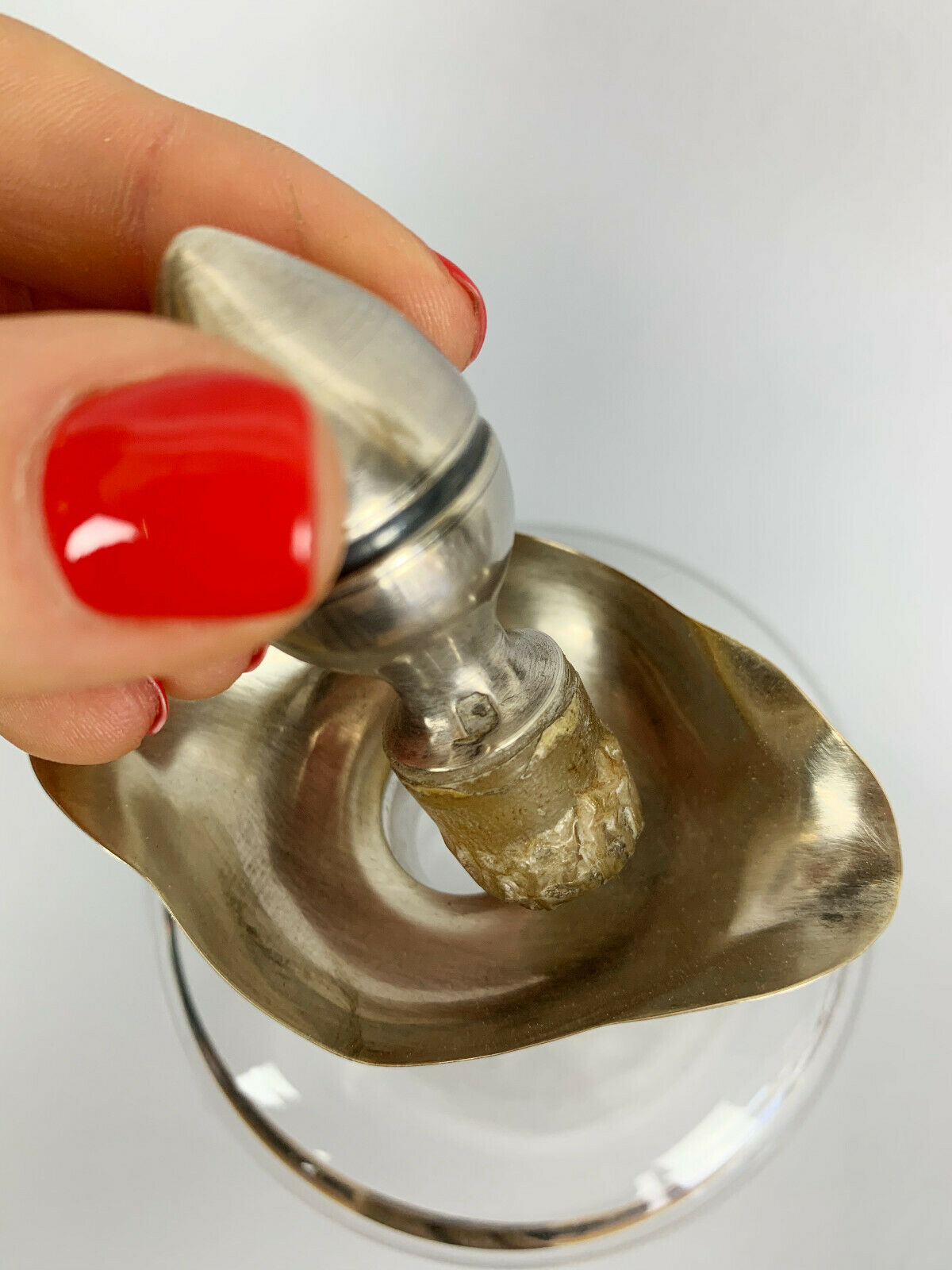 Blown glass carafe with silver frame and cap