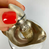 Blown glass carafe with silver frame and cap