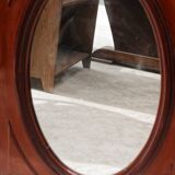 Oval mirror in beveled glass and solid mahogany