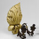 Pair of Hollywood Regency sconces in carved, painted and patinated wood, 1950s