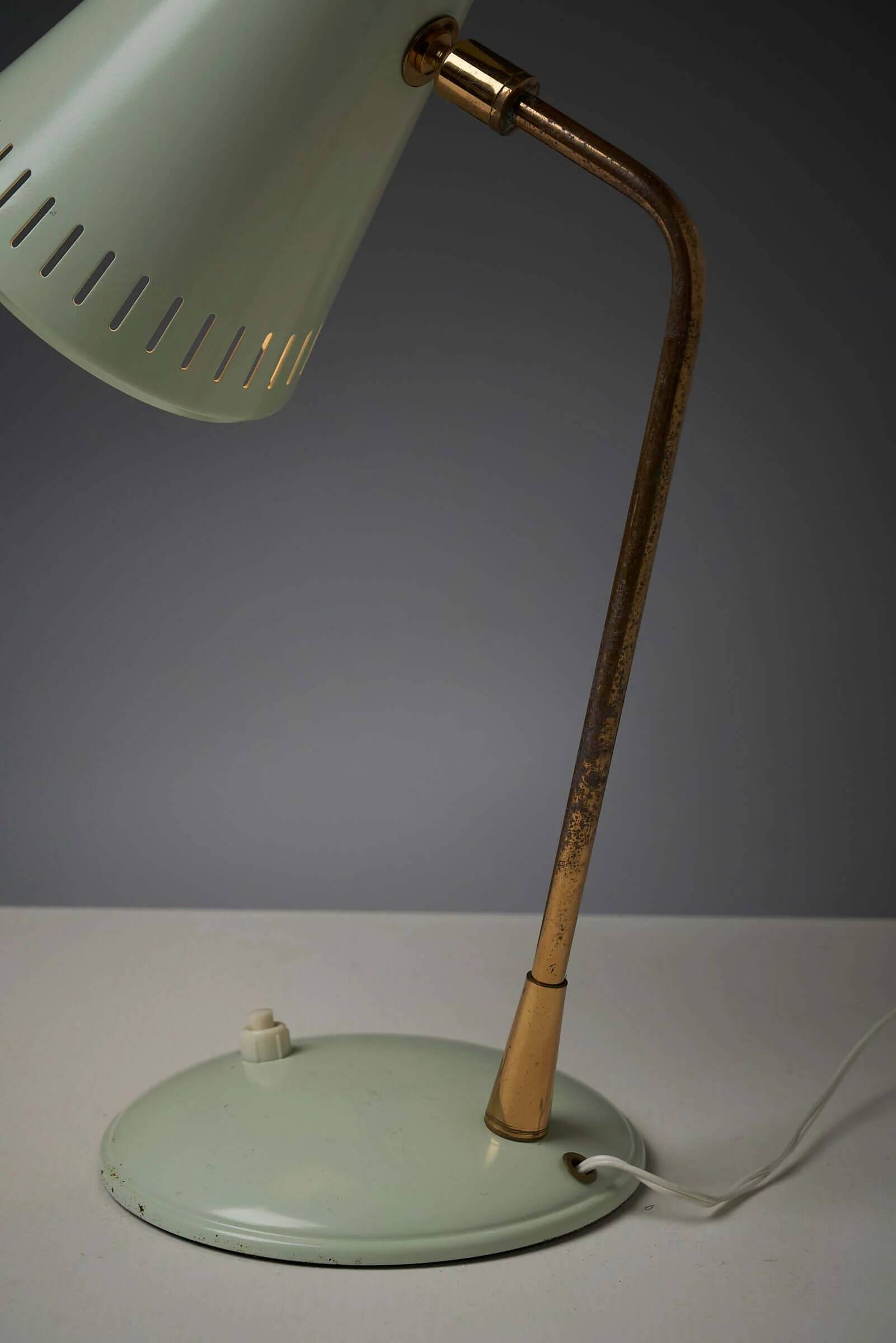 Adjustable table lamp in patinated brass and green metal
