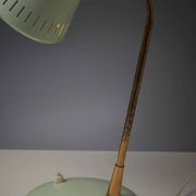 Adjustable table lamp in patinated brass and green metal