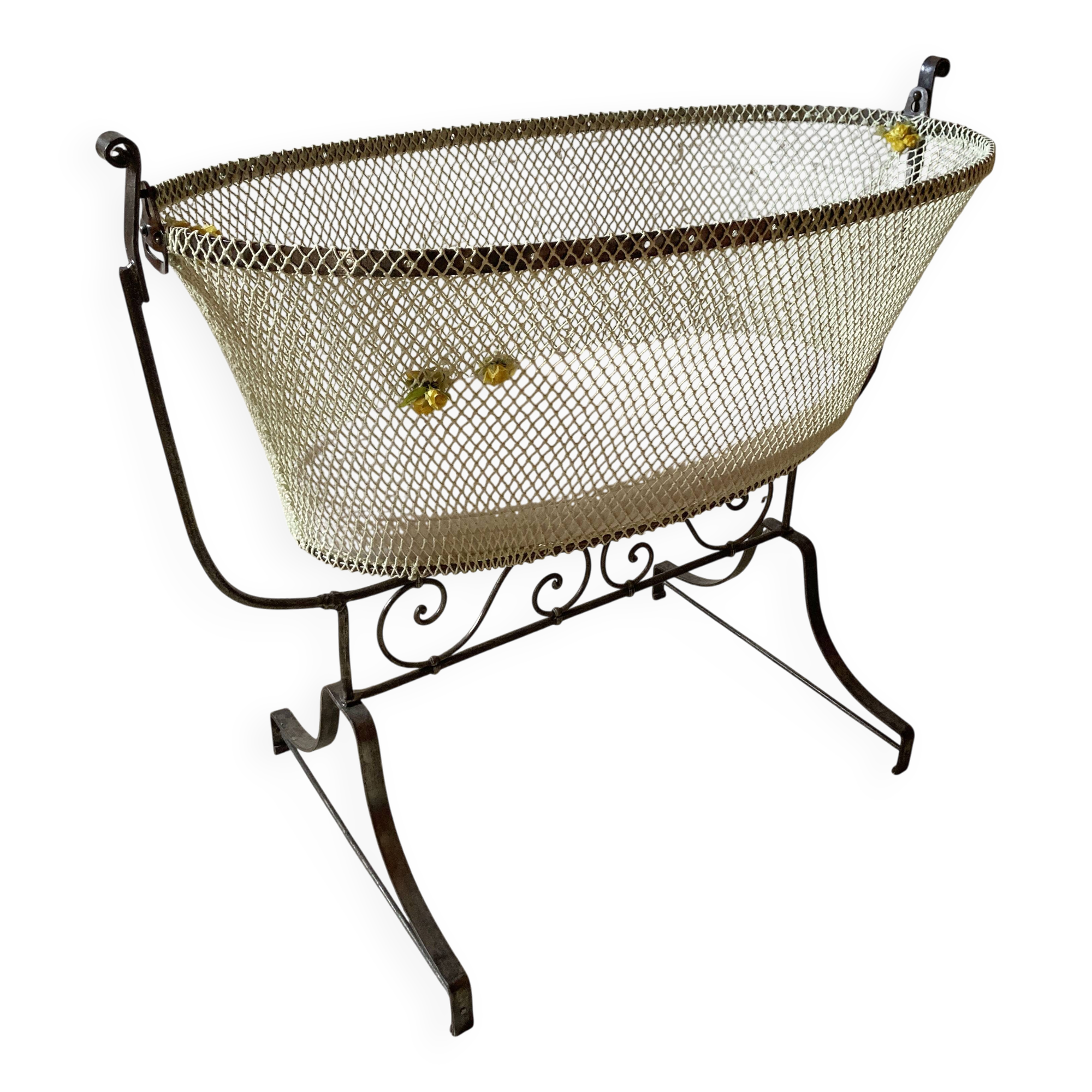 Antique rocking cradle in wrought iron