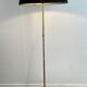 Brass floor lamp with a tripod base and claw feet from Maison Jansen.