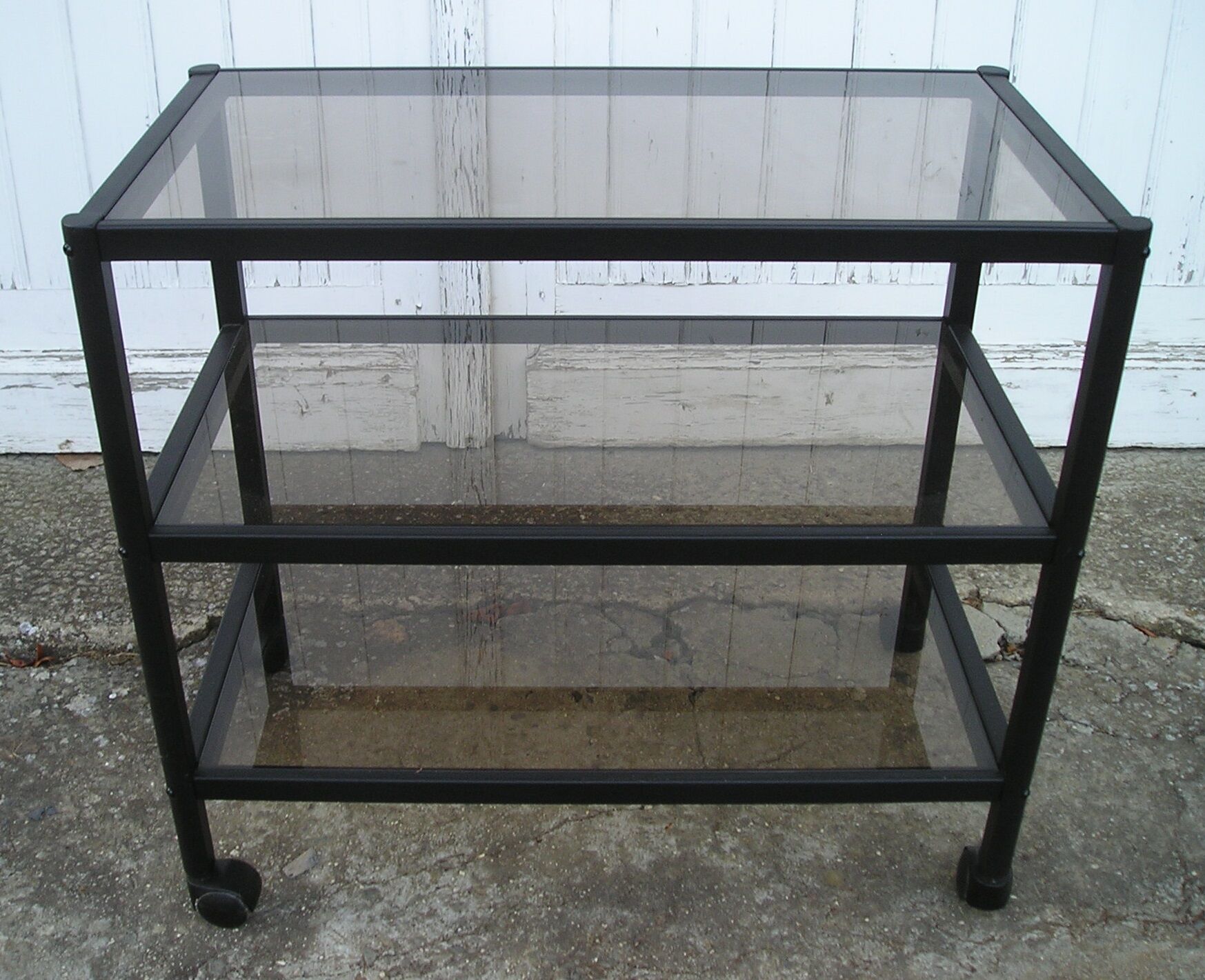 Rolling table serves 3 trays of smoked glass