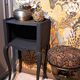 1930 bedside table, repainted wood in black with a golden rose motif.