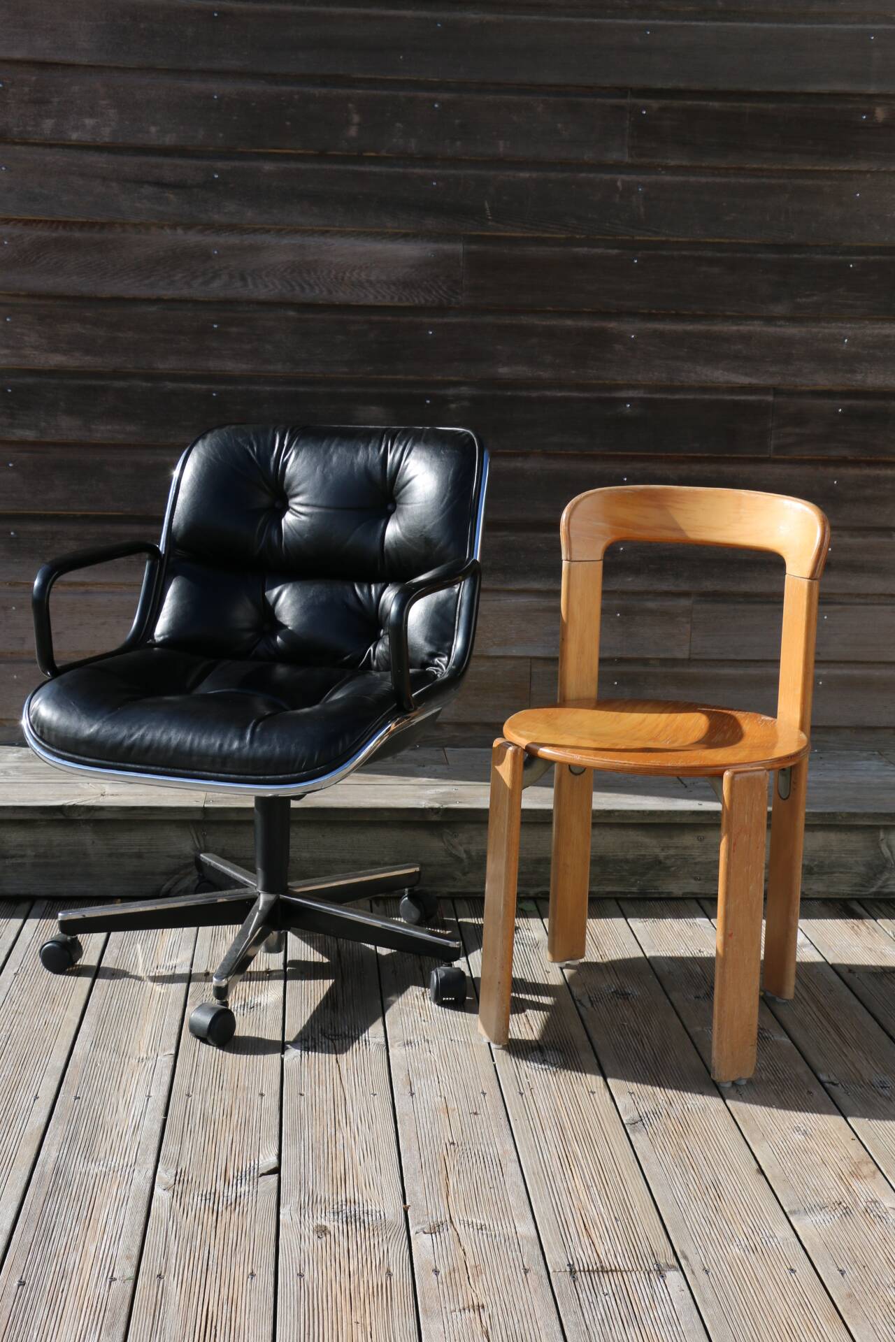 POLLOCK black leather reclining armchair with casters