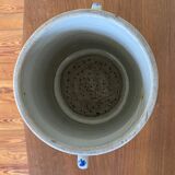 Old pot, sandstone, blue flower decoration