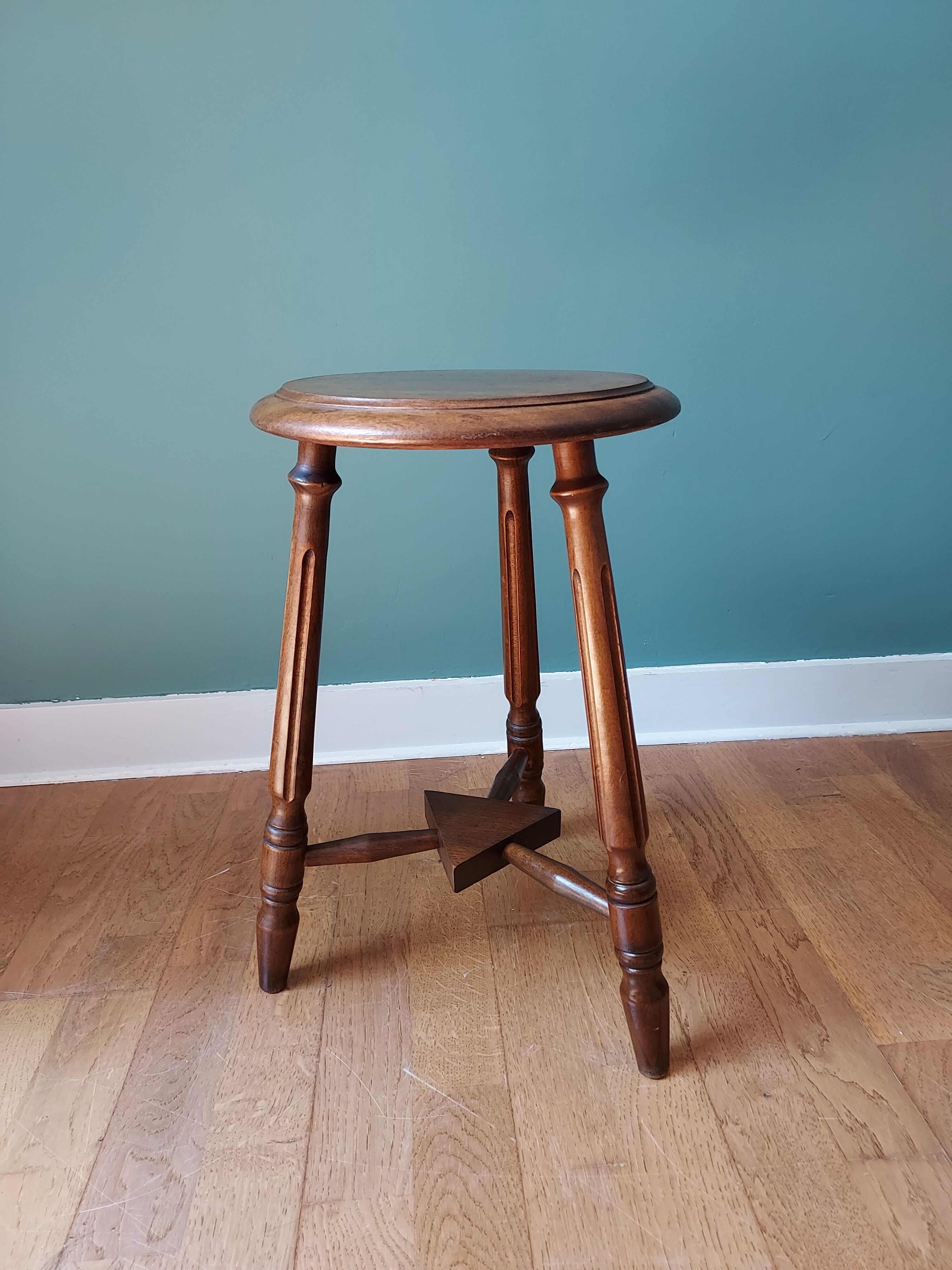 Carved tripod stool