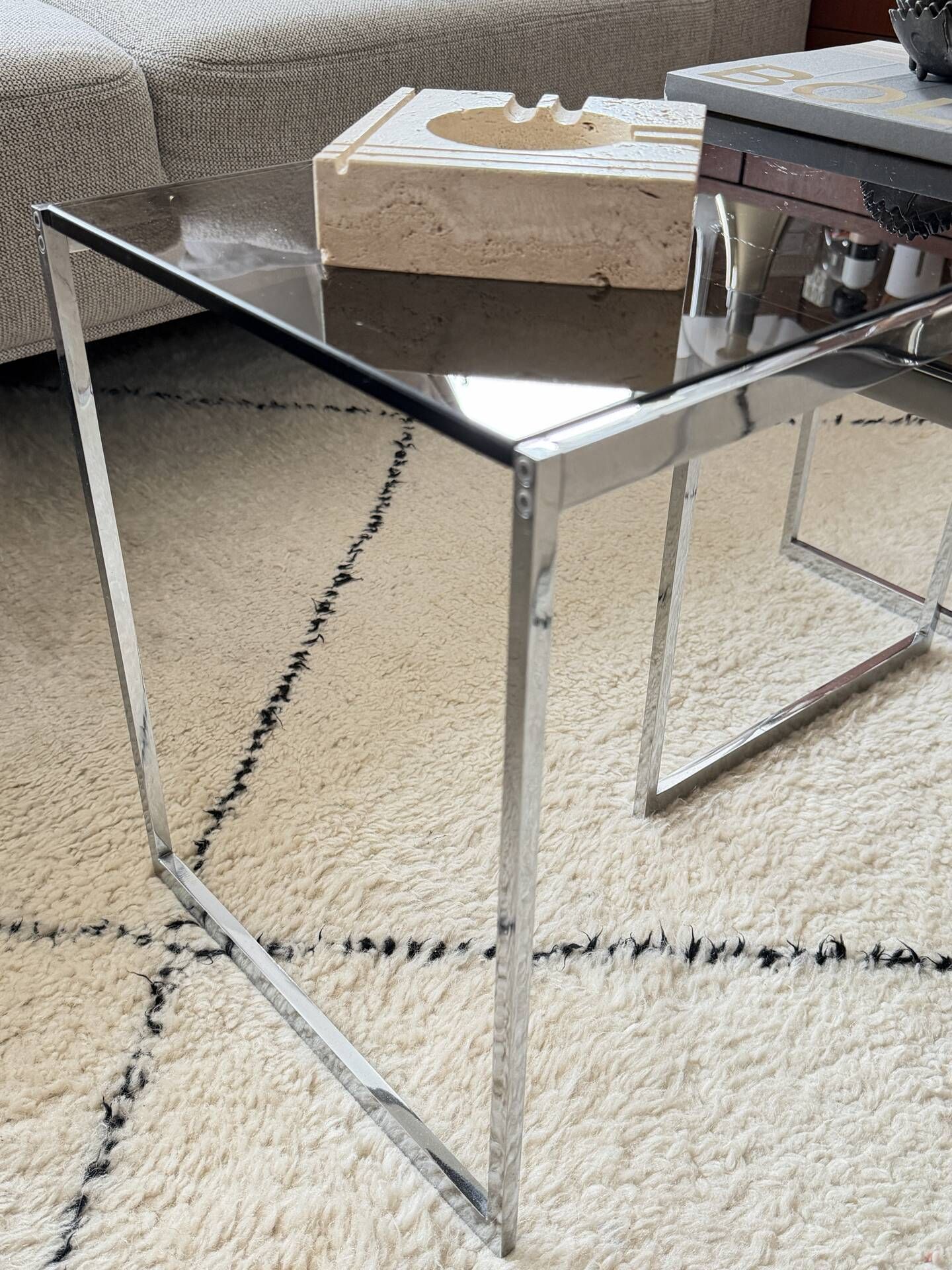 Set of 2 vintage nesting coffee tables in chrome metal and smoked glass.