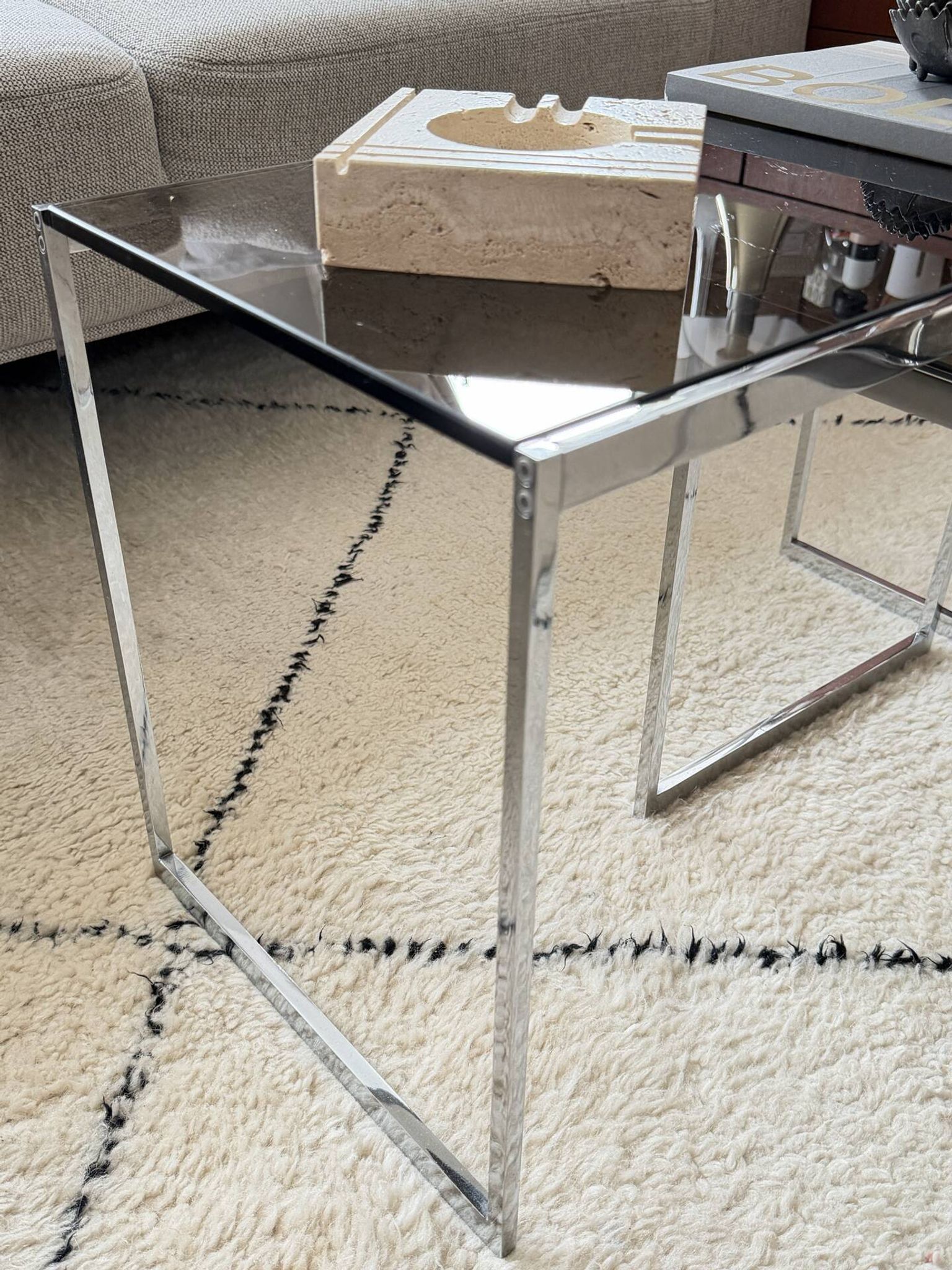 Set of 2 vintage nesting coffee tables in chrome metal and smoked glass.