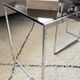 Set of 2 vintage nesting coffee tables in chrome metal and smoked glass.