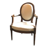 Louis XVI period cabriolet armchair with medallion back