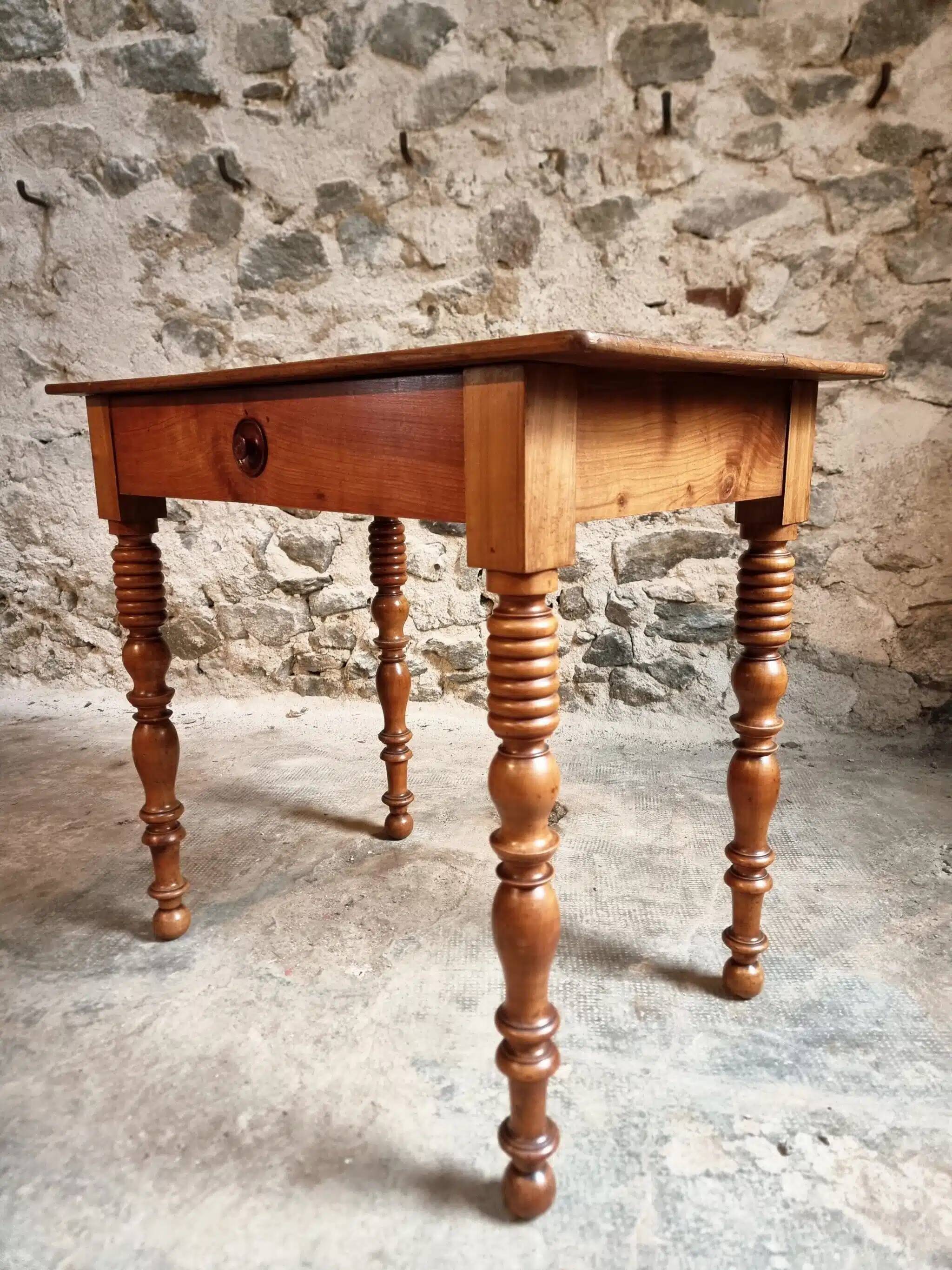 Small antique French writing table in walnut with a drawer, around 1900.