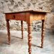Small antique French writing table in walnut with a drawer, around 1900.