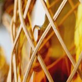 Carafe and glasses in blown amber glass and wicker