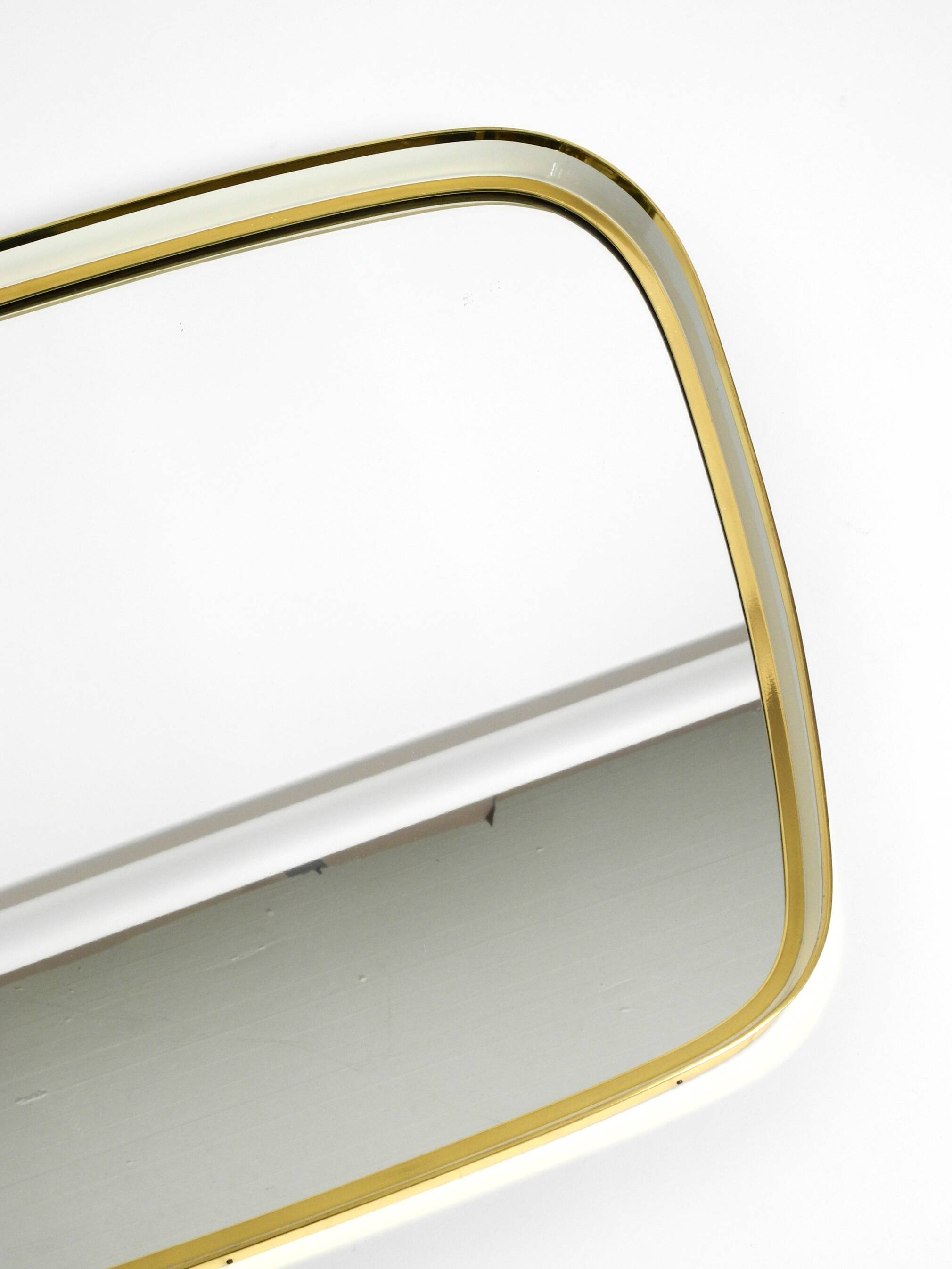 Huge Mid Century "Zier-Form" wall mirror with heavy brass frame with Label