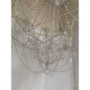 Contemporary ivory florentine iron and crystals chandelier