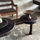 Small antique Indonesian bench in carved teak with plant and floral motifs.