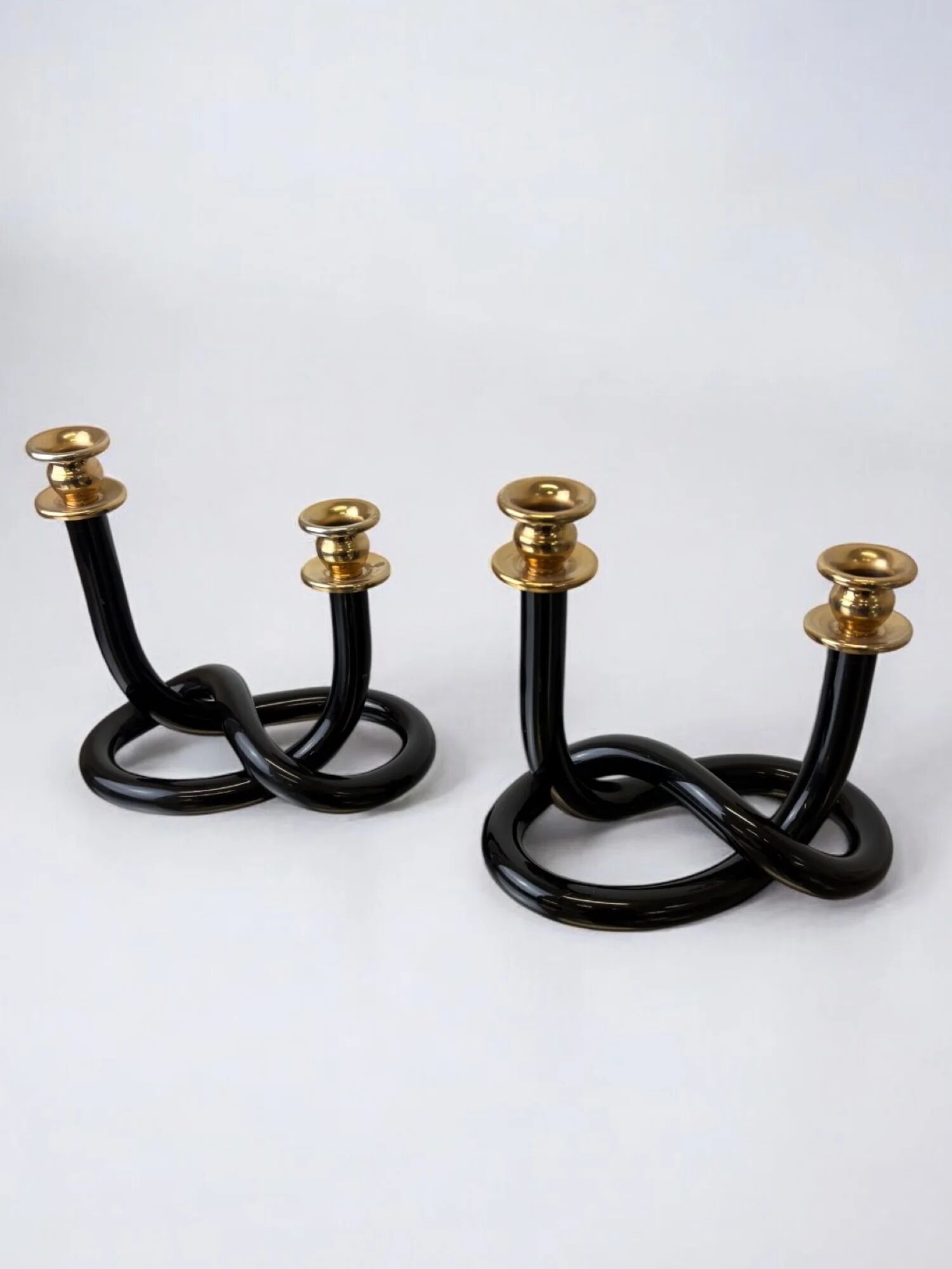 Pair of black pretzel candlesticks by Dorothy Thorpe, circa 1970s