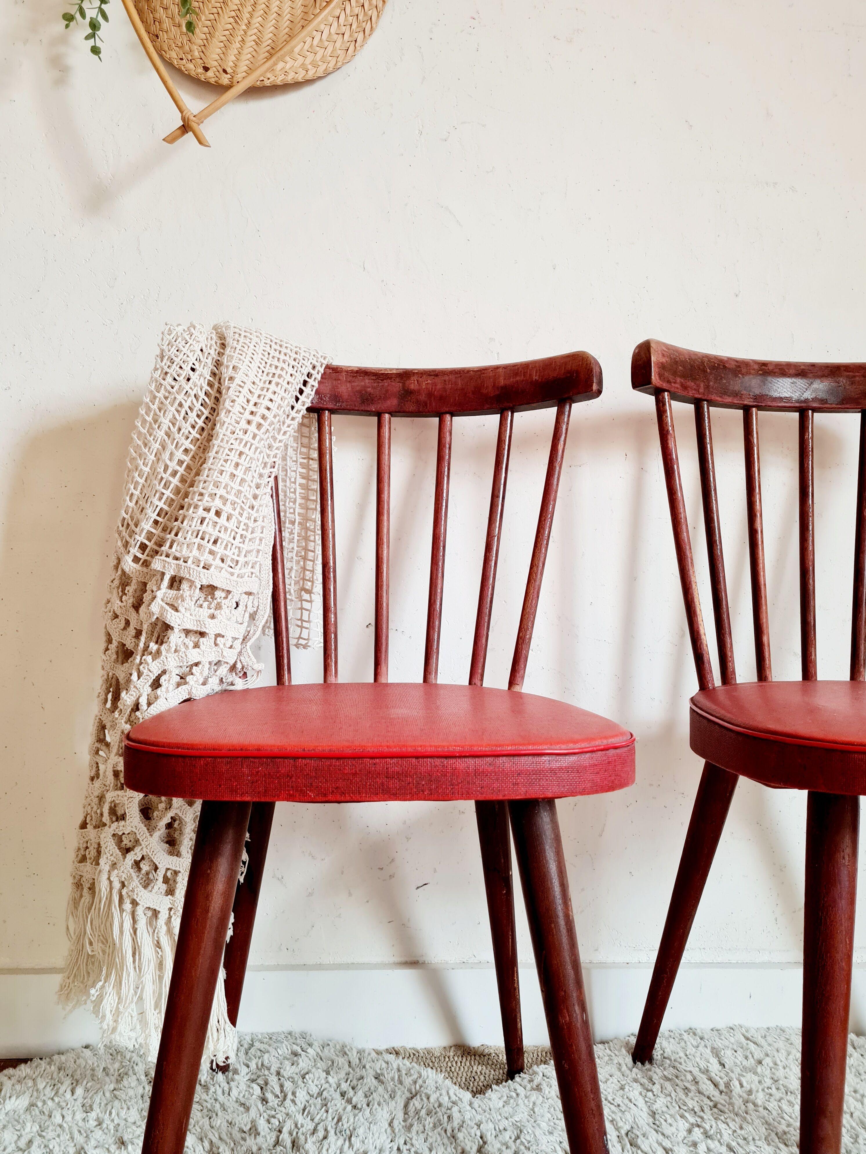 Pair of wooden bistro chairs and red imitation seating
