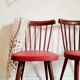 Pair of wooden bistro chairs and red imitation seating