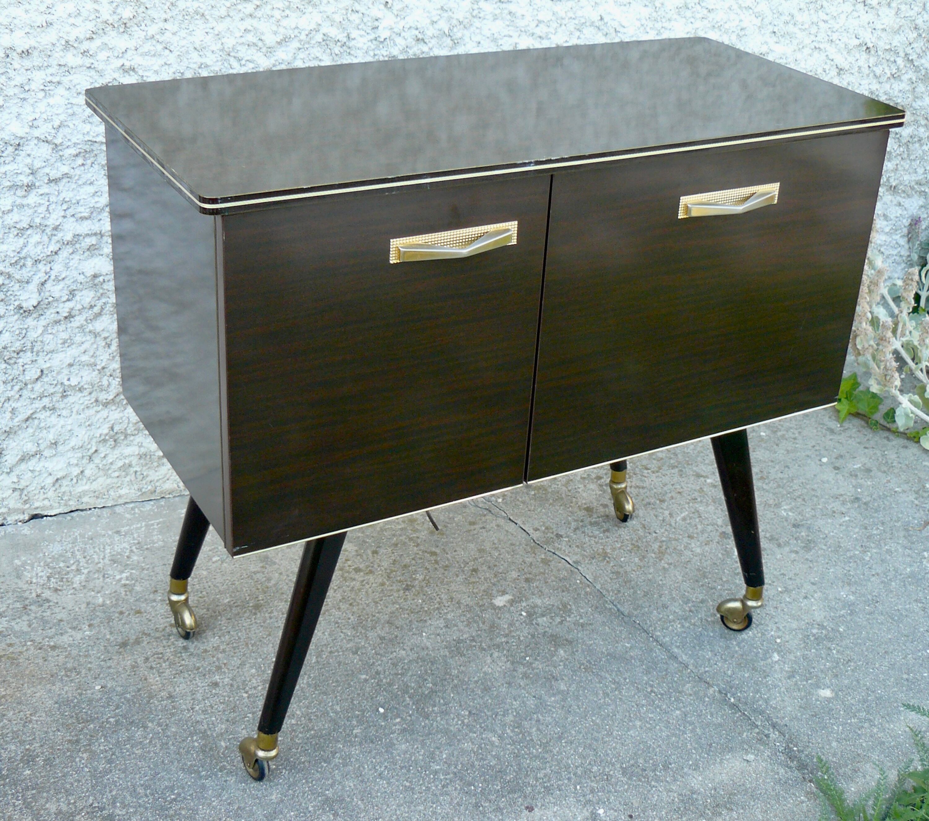 Vintage 1960s rolling and lighting bar with compass legs