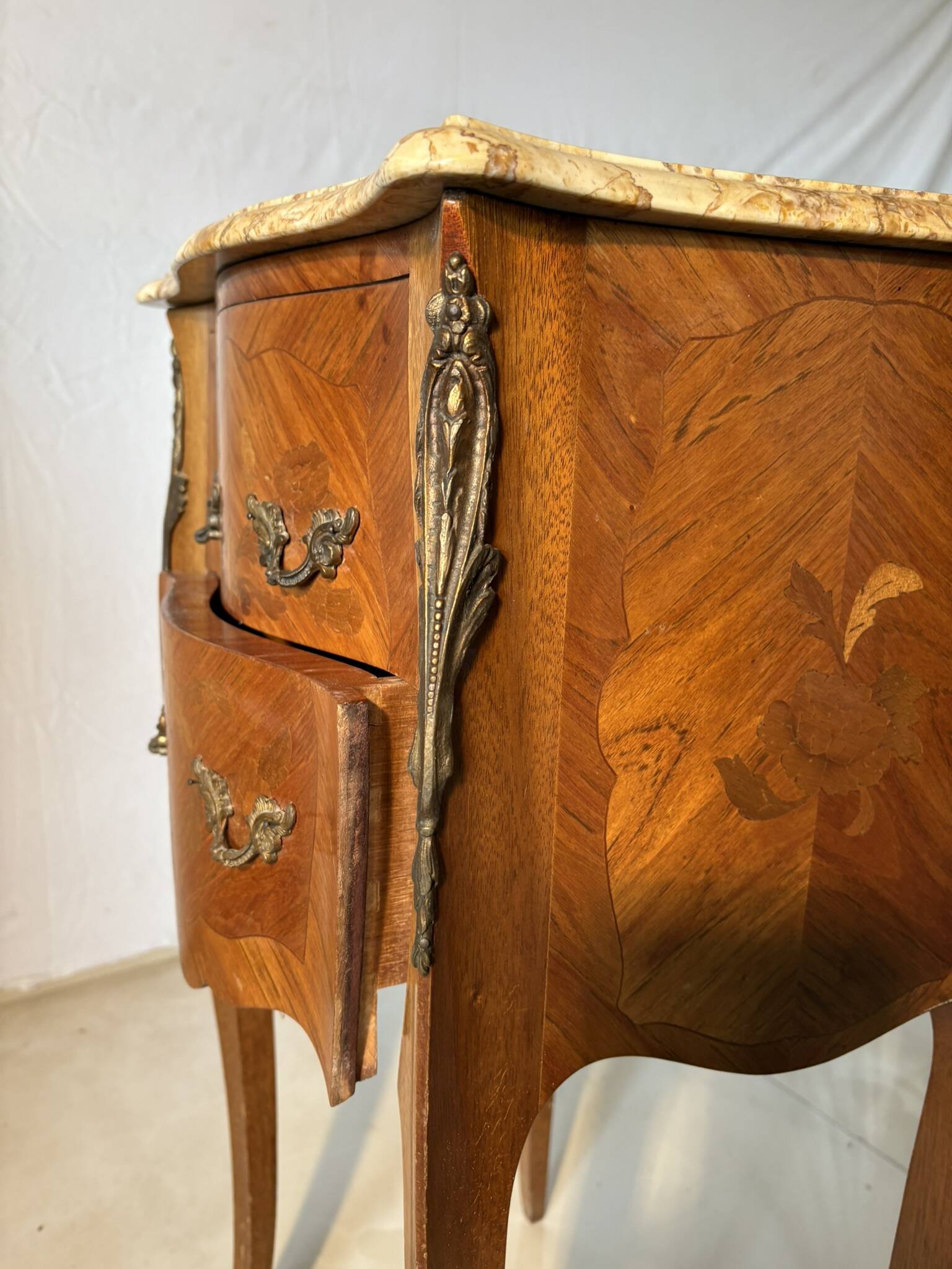 Small curved Louis XV style piece of furniture – marquetry and marble top