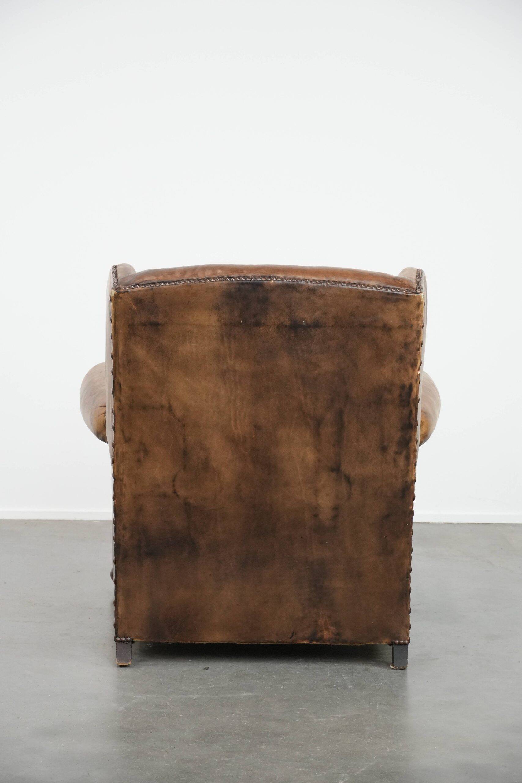 Luxury and large cowhide leather wingback chair in English style