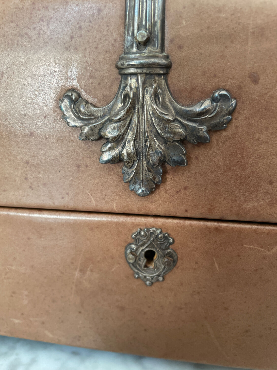 Vintage leather and silver metal jewelry box.