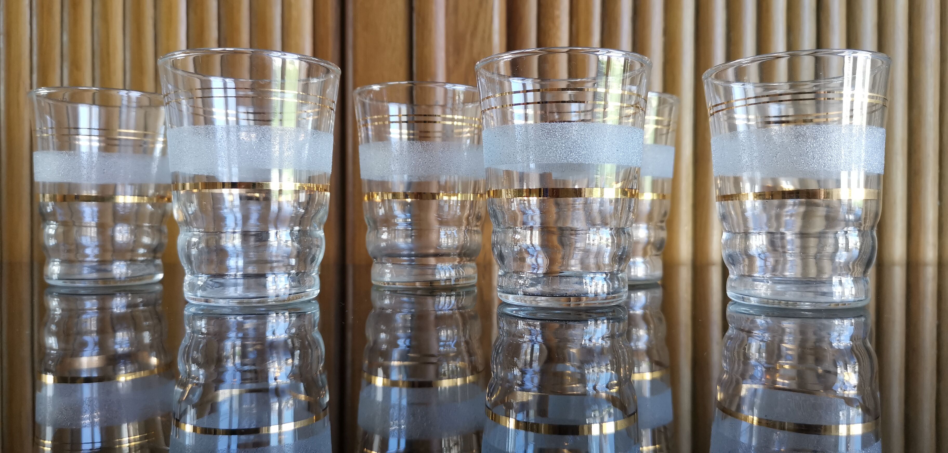 8 granite glasses bordered gold 1950s