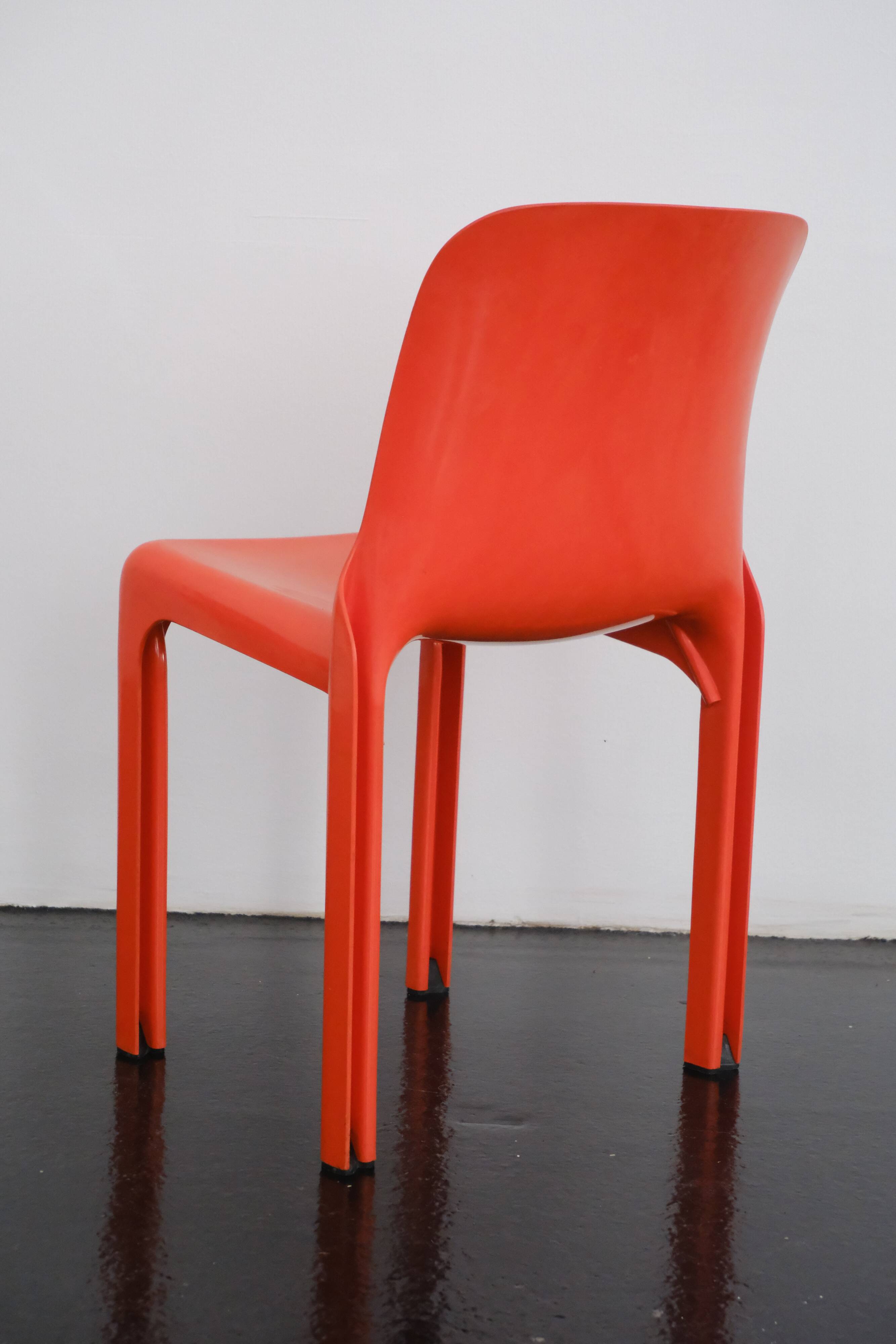 Orange "Selene" chair by Vico Magistretti / Artemide