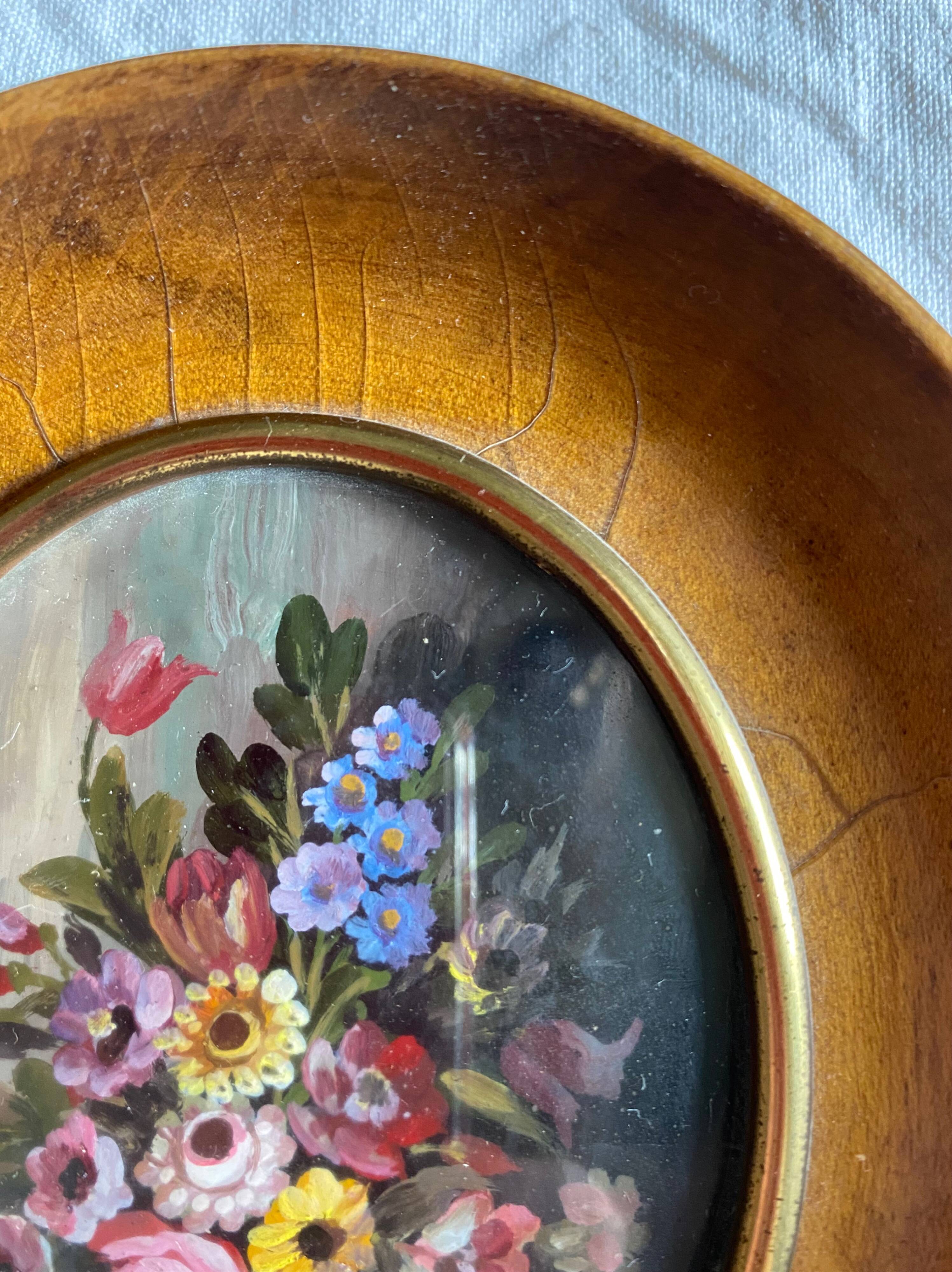 Old painting "bouquet of flowers" with oval frame and glass