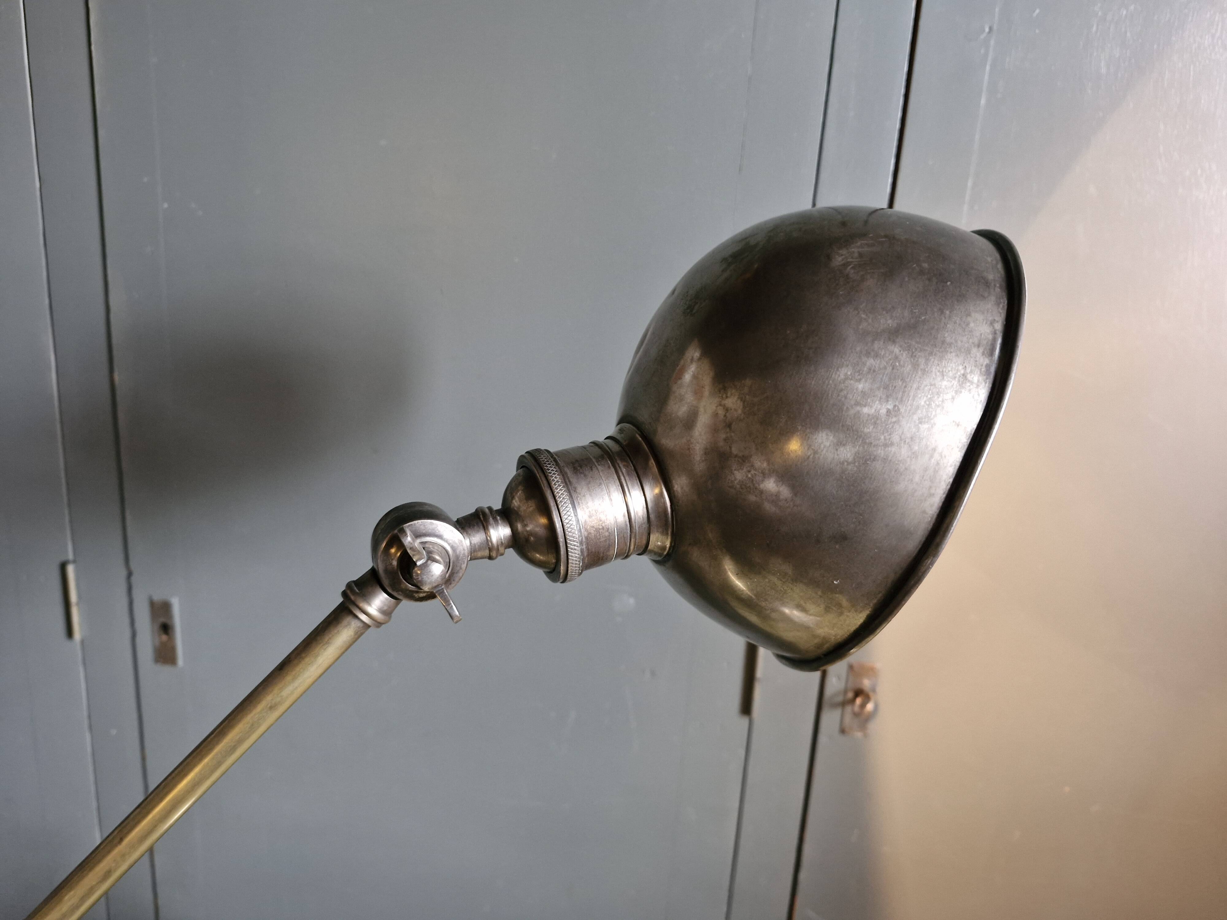 Old adjustable industrial lamp in bronze with 2 arms.