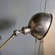 Old adjustable industrial lamp in bronze with 2 arms.