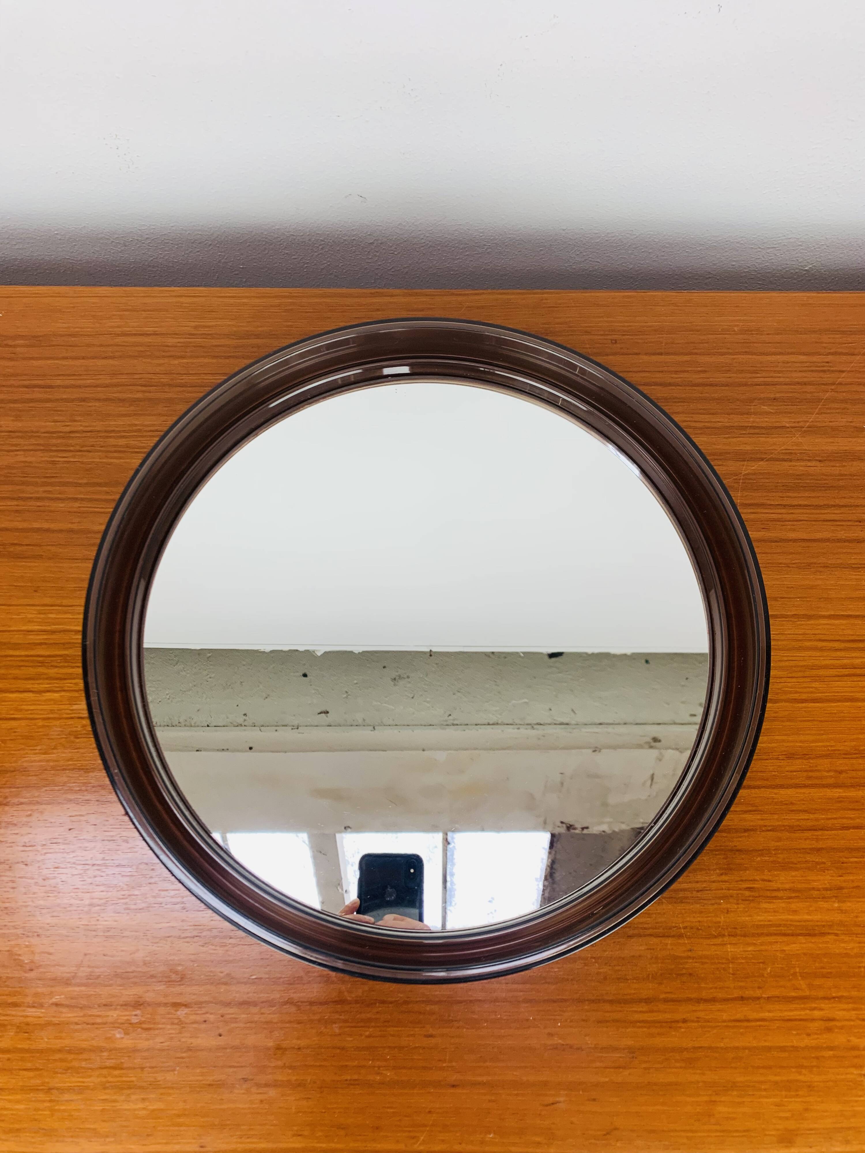 Round mirror with amber rim from the 70s, vintage