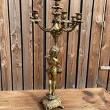 Large bronze candle holder with putti angel