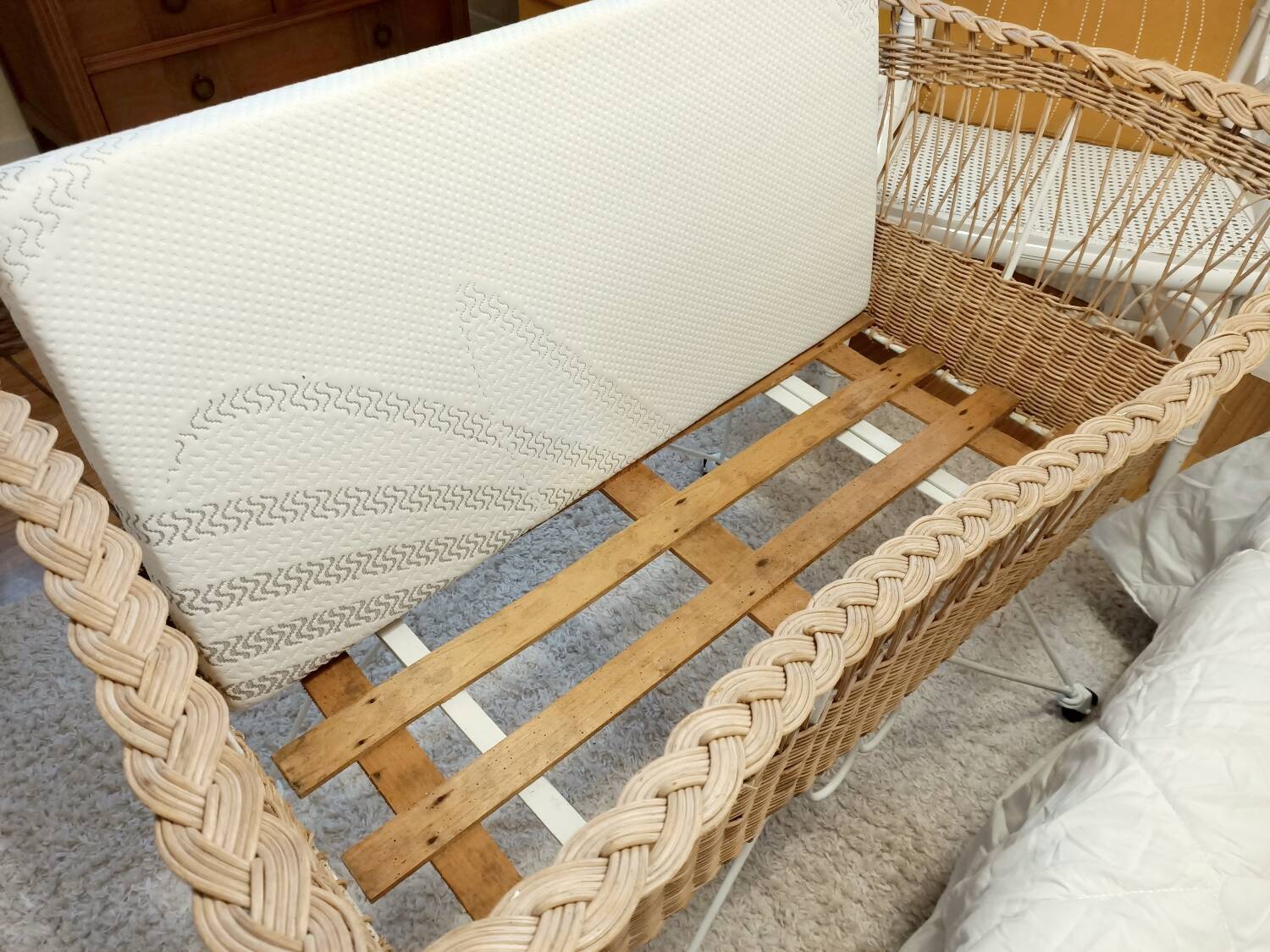 Rattan and wrought iron cradle