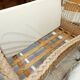 Rattan and wrought iron cradle
