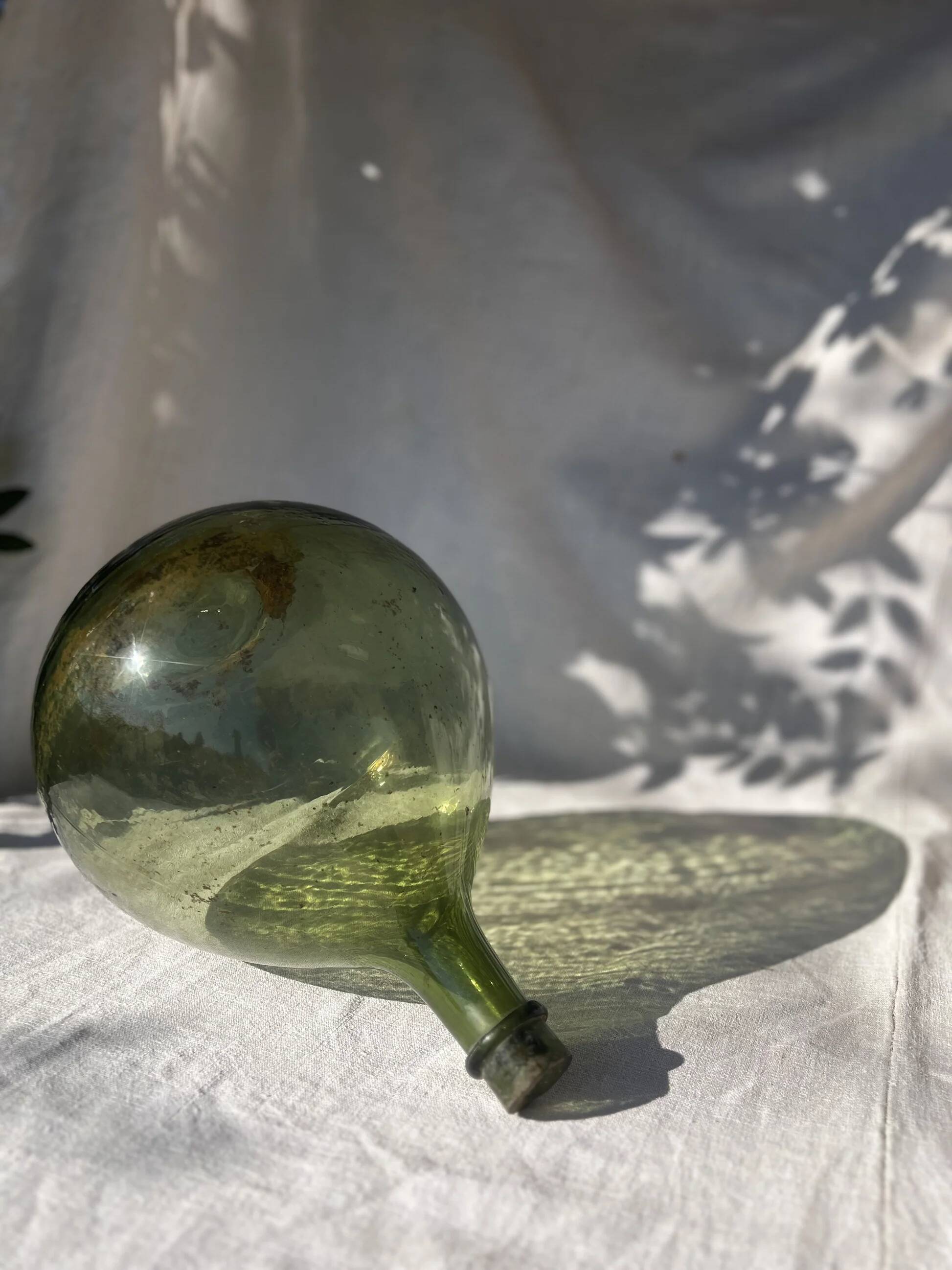 Large French green glass demijohn
