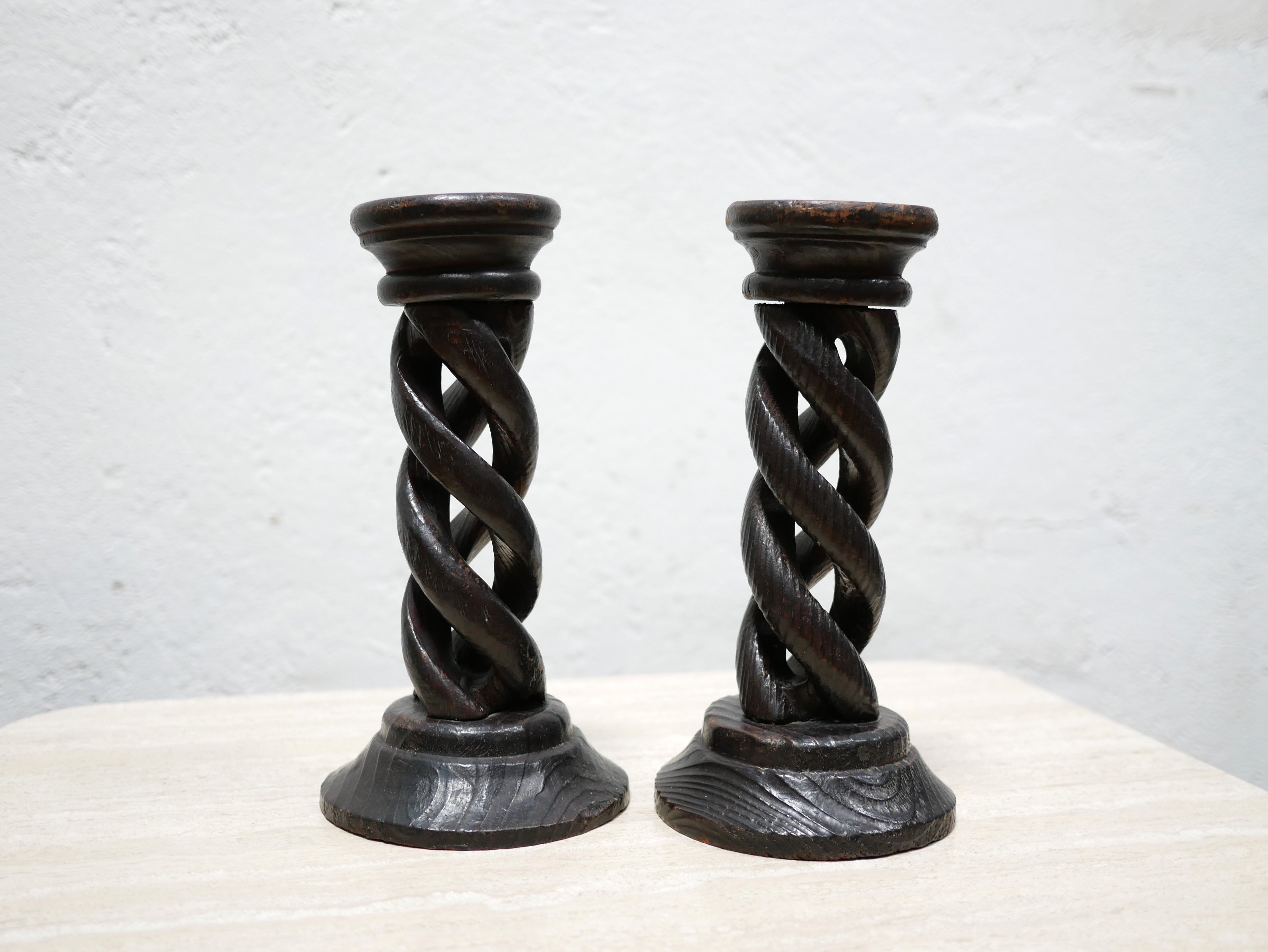 Pair of antique turned wooden candle holders