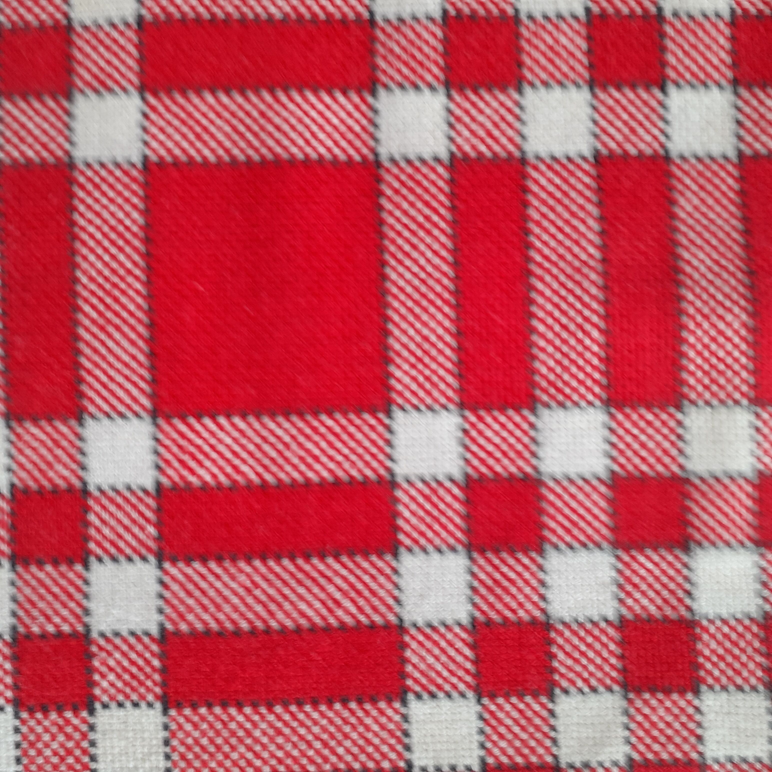 Old tablecloth with small red and white tiles. Cotton- pais.
