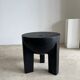 Black mango wood tripod side table with a semi-spherical top, height: 45 cm, diameter: 44 cm.